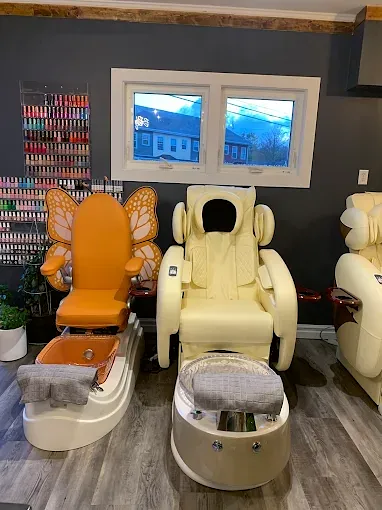 Orange butterfly pedicure chair beside a wall of nail polish