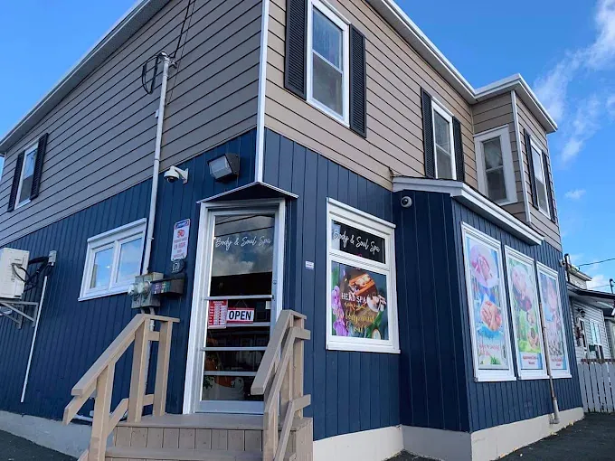 The navy Body & Soul Spa building on St. Clare Avenue