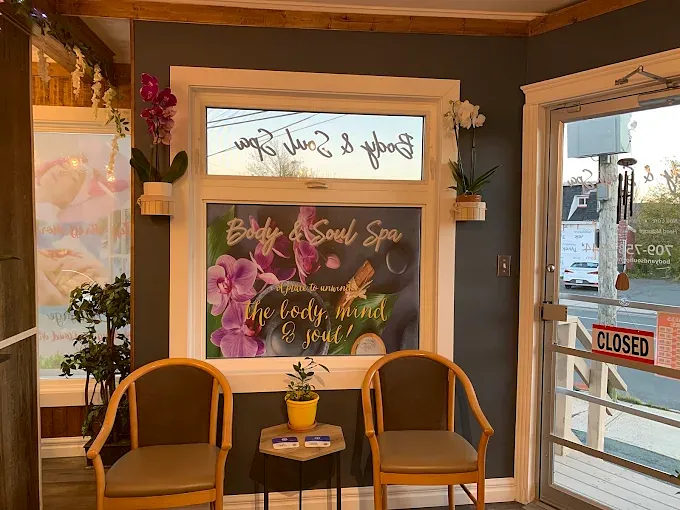 Waiting nook with two chairs under the spa window decal